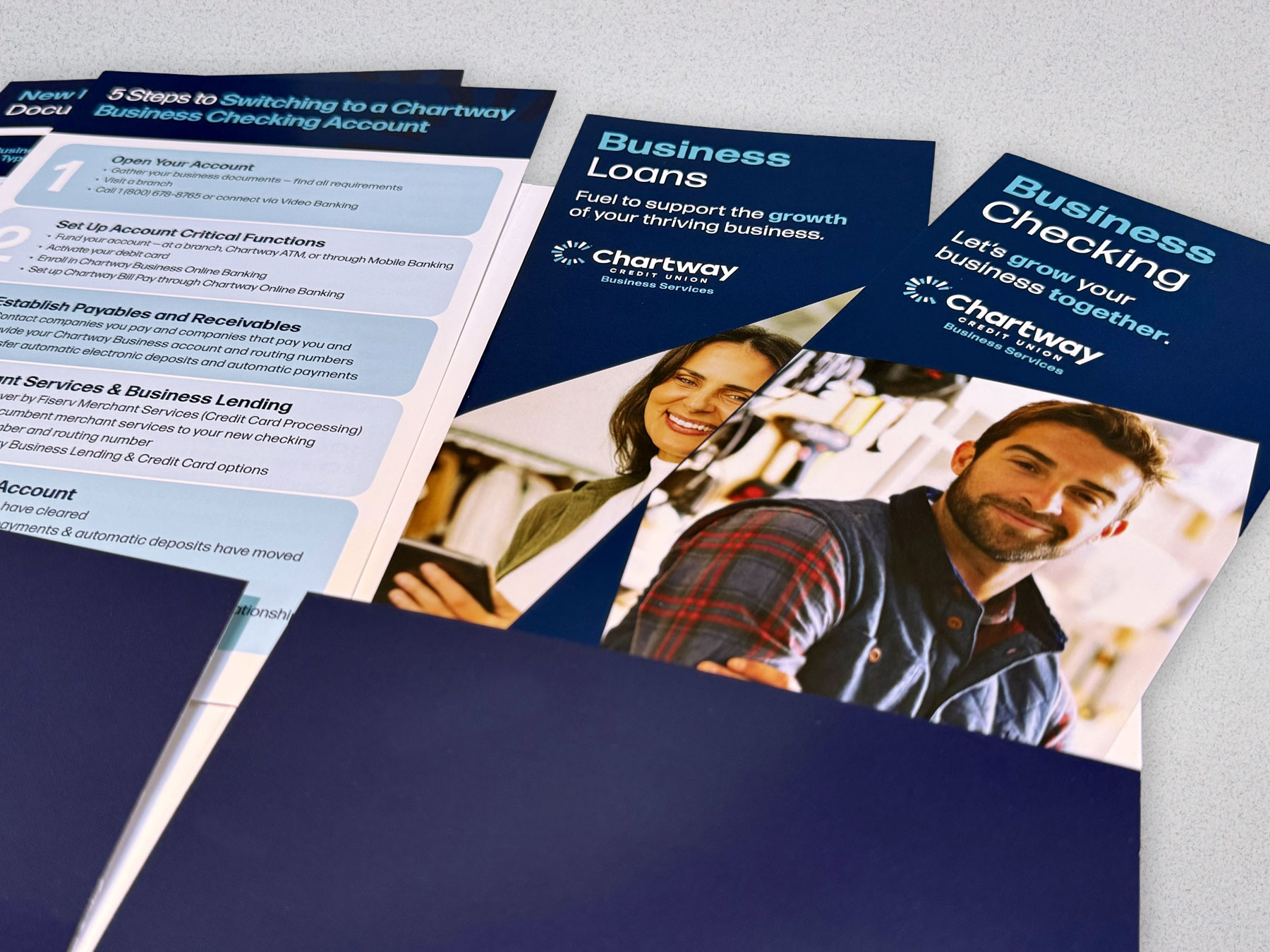 Chartway Business Loans and Business Checking brochures with a "5 steps to switching" guide, in a navy folder